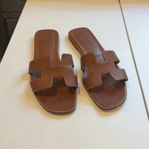 Hermès Oran leather mules